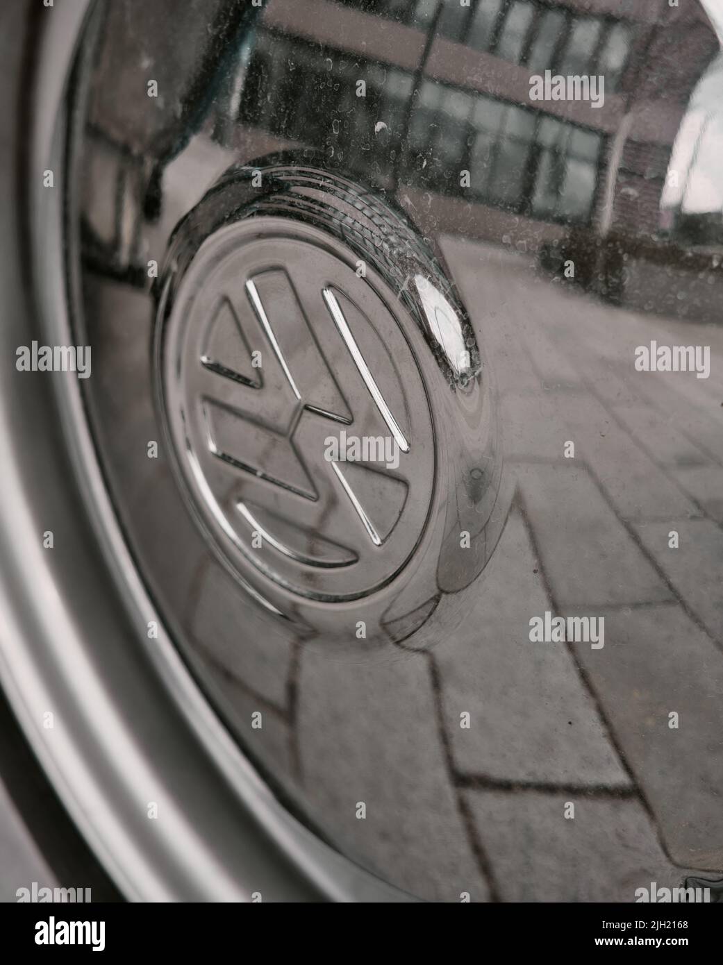 The vertical close-up Volkswagen logo on the car petrol cap Stock Photo