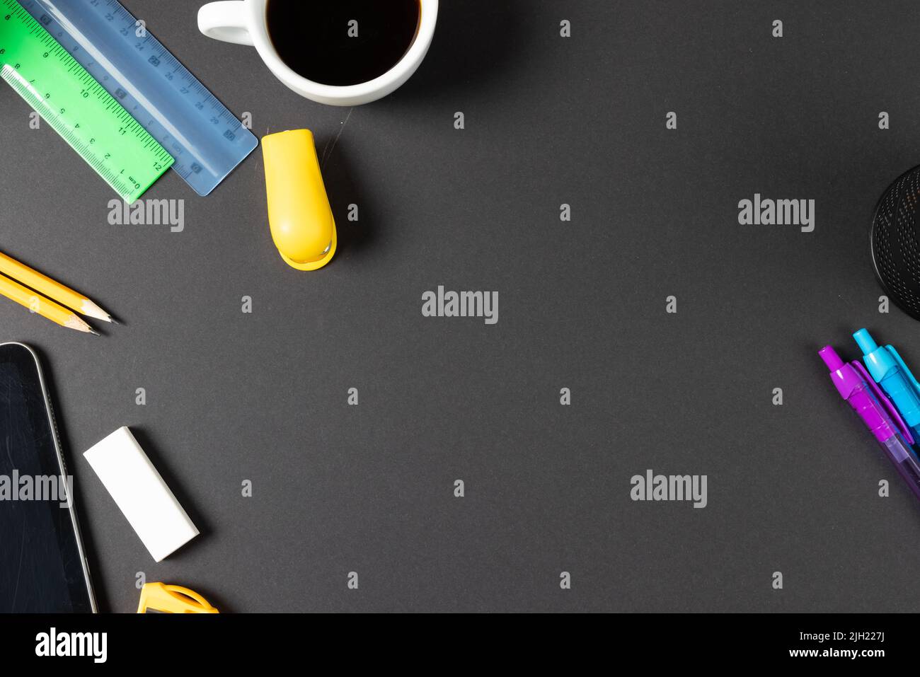 Imagine of various office supplies, pins, rulers, scissorson and