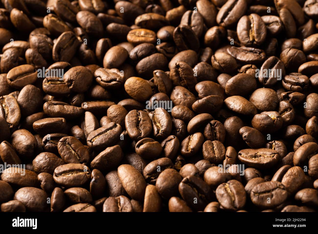 Image of close up of pile of roasting brown coffee beans Stock Photo ...