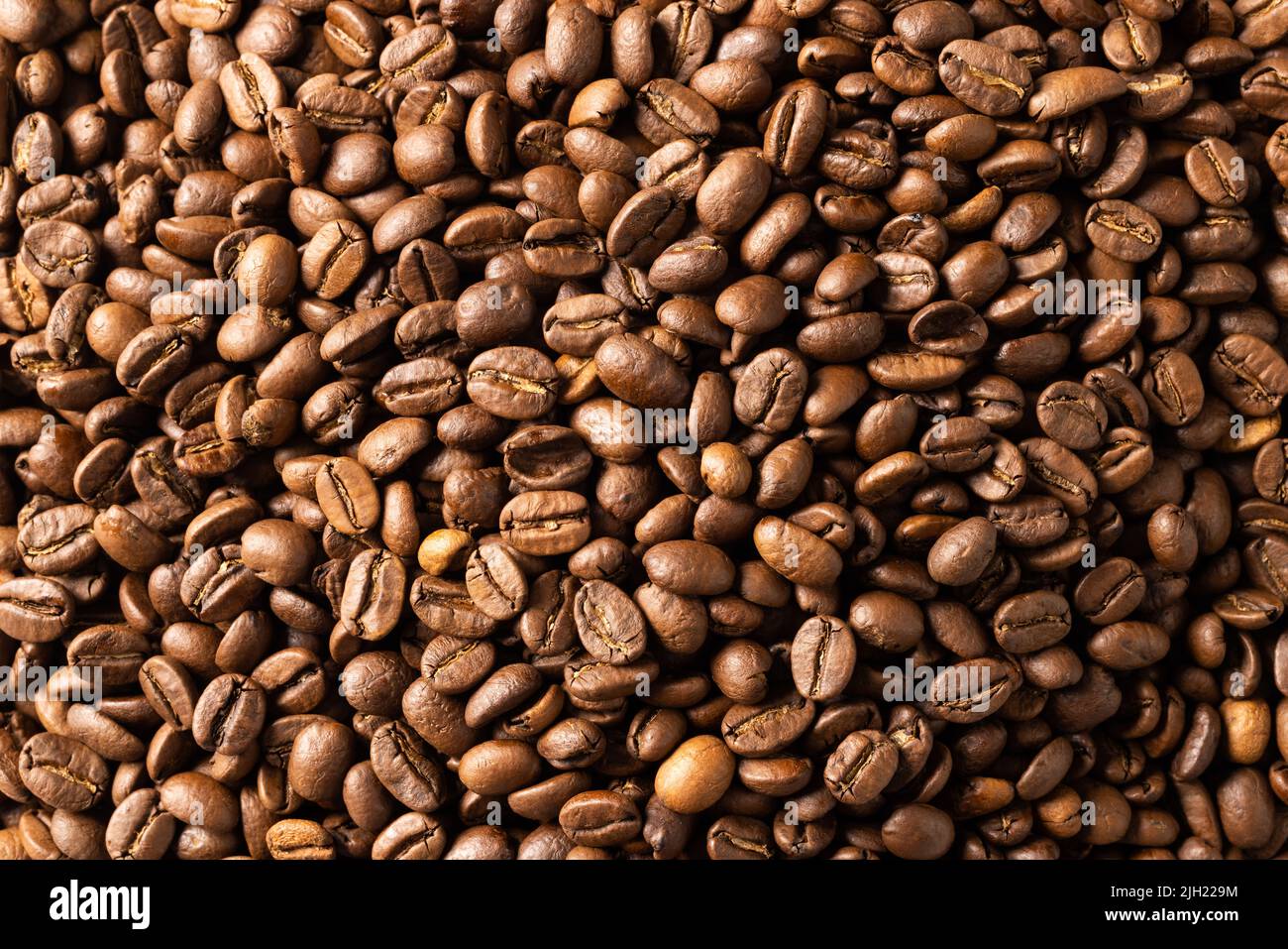 Image of close up of pile of roasting brown coffee beans Stock Photo ...