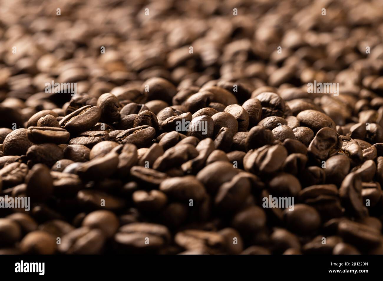 Image of close up of pile of roasting brown coffee beans Stock Photo ...