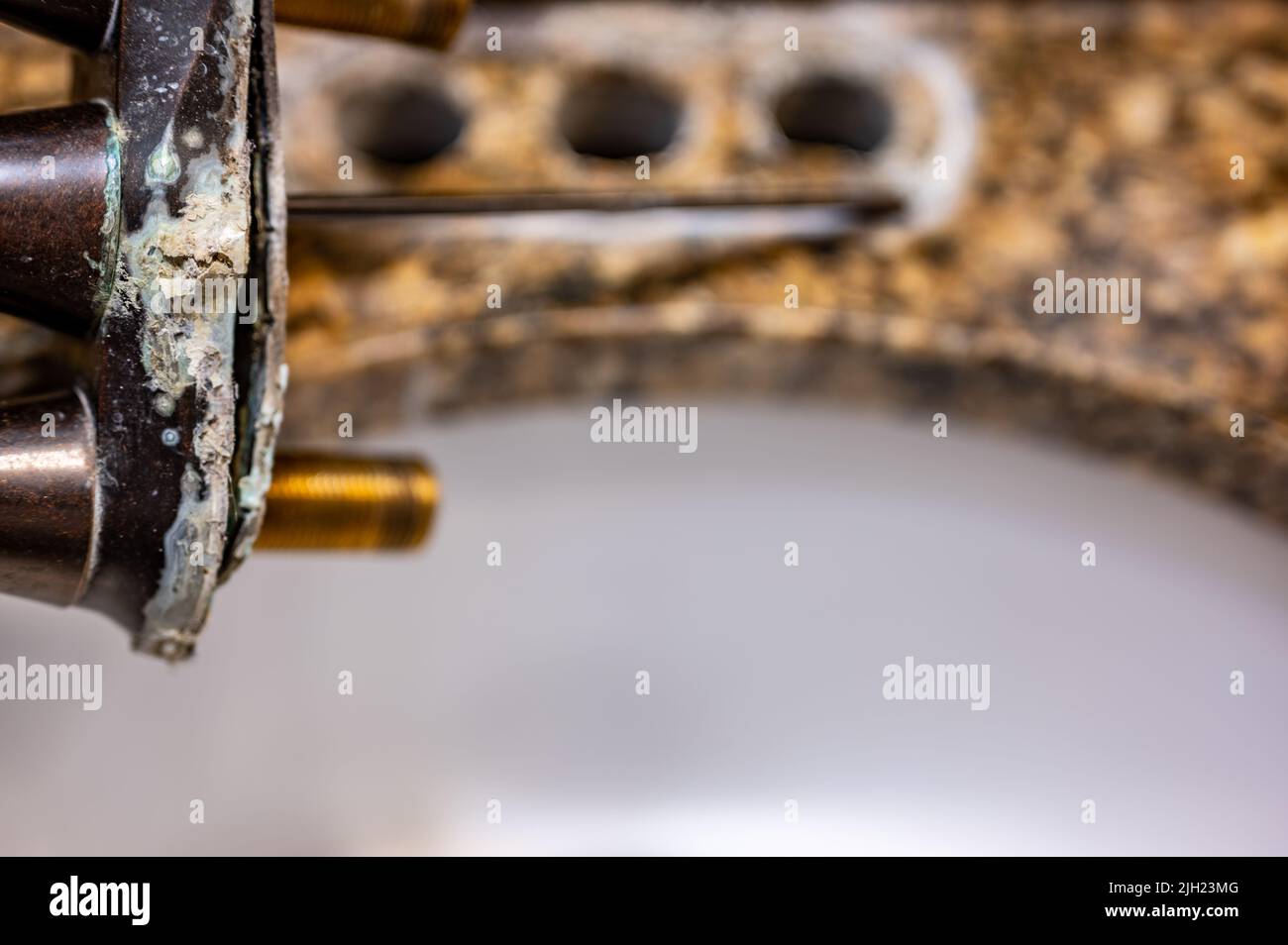 Replacing a bathroom sink faucet with a new assembly Stock Photo Alamy