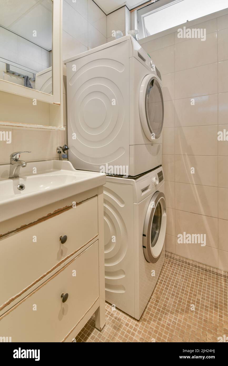 Glass partition between shower tap and wall hung toilet in modern
