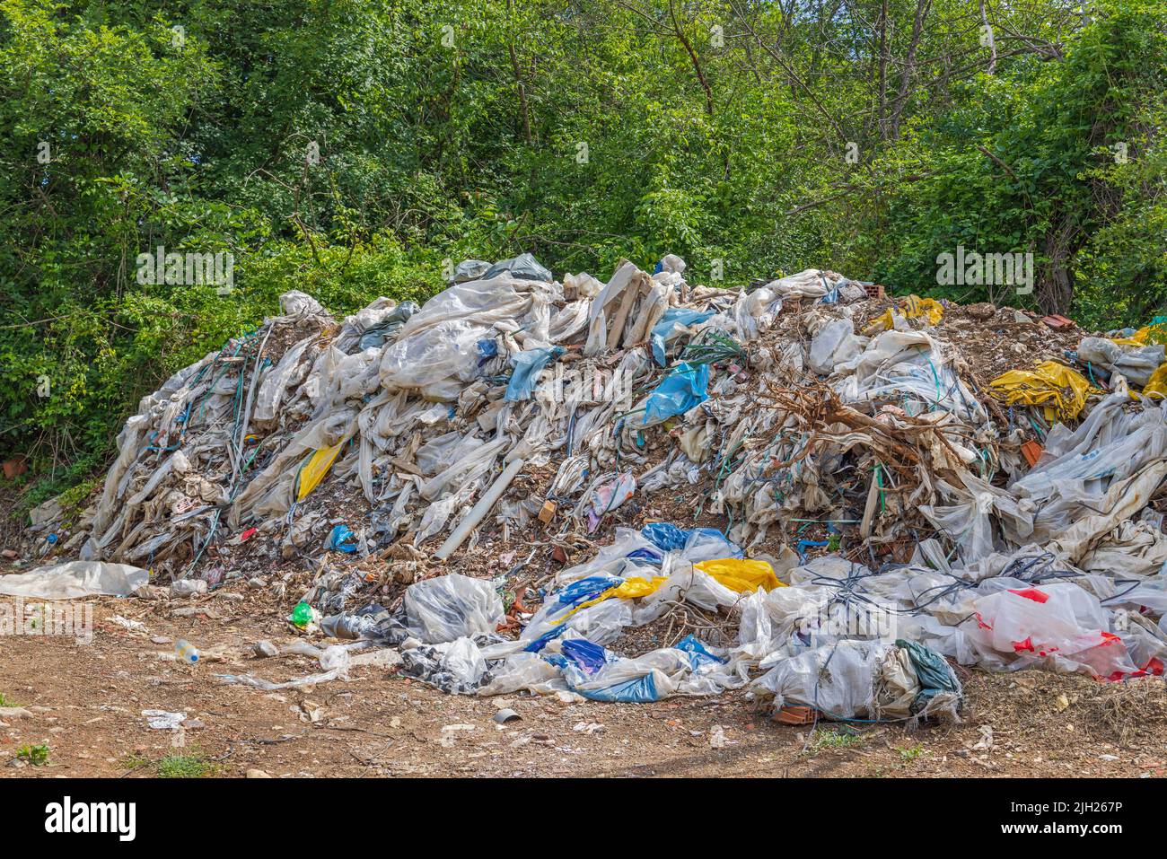 Big Pile of Trash Waste Illegal Dump Site Pollution in Nature Stock