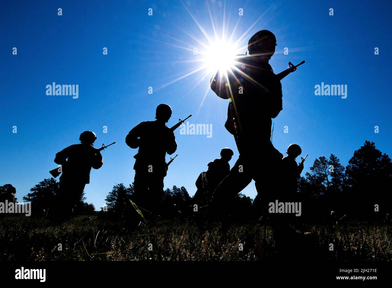 Colorado Springs, United States of America. 12 July, 2022. U.S. Air Force Academy students are silhouetted by the summer sun during the Basic Cadet Training assault course at the Air Force Academy Jacks Valley, July 12, 2022 in Colorado Springs, Colorado. Basic Cadet Training is a six-week indoctrination program to transformation civilian students into military academy cadets. Credit: Trevor Cokley/US Air Force Photo/Alamy Live News Stock Photo