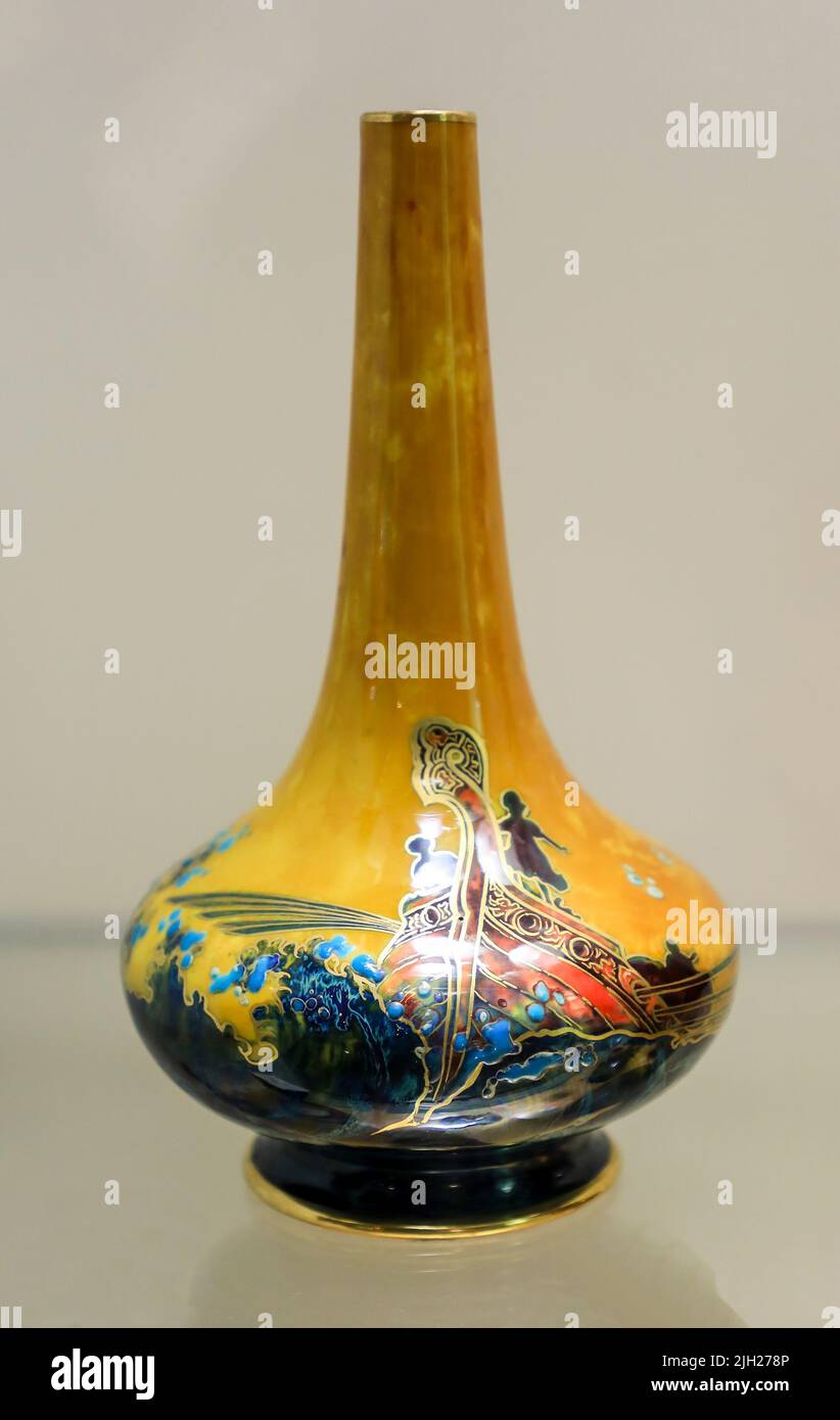 A vase with painted and gilded scene of longboat and figures at the Potteries Museum and Art Gallery, Hanley, Stoke-on-Trent, Staffs, England, UK Stock Photo