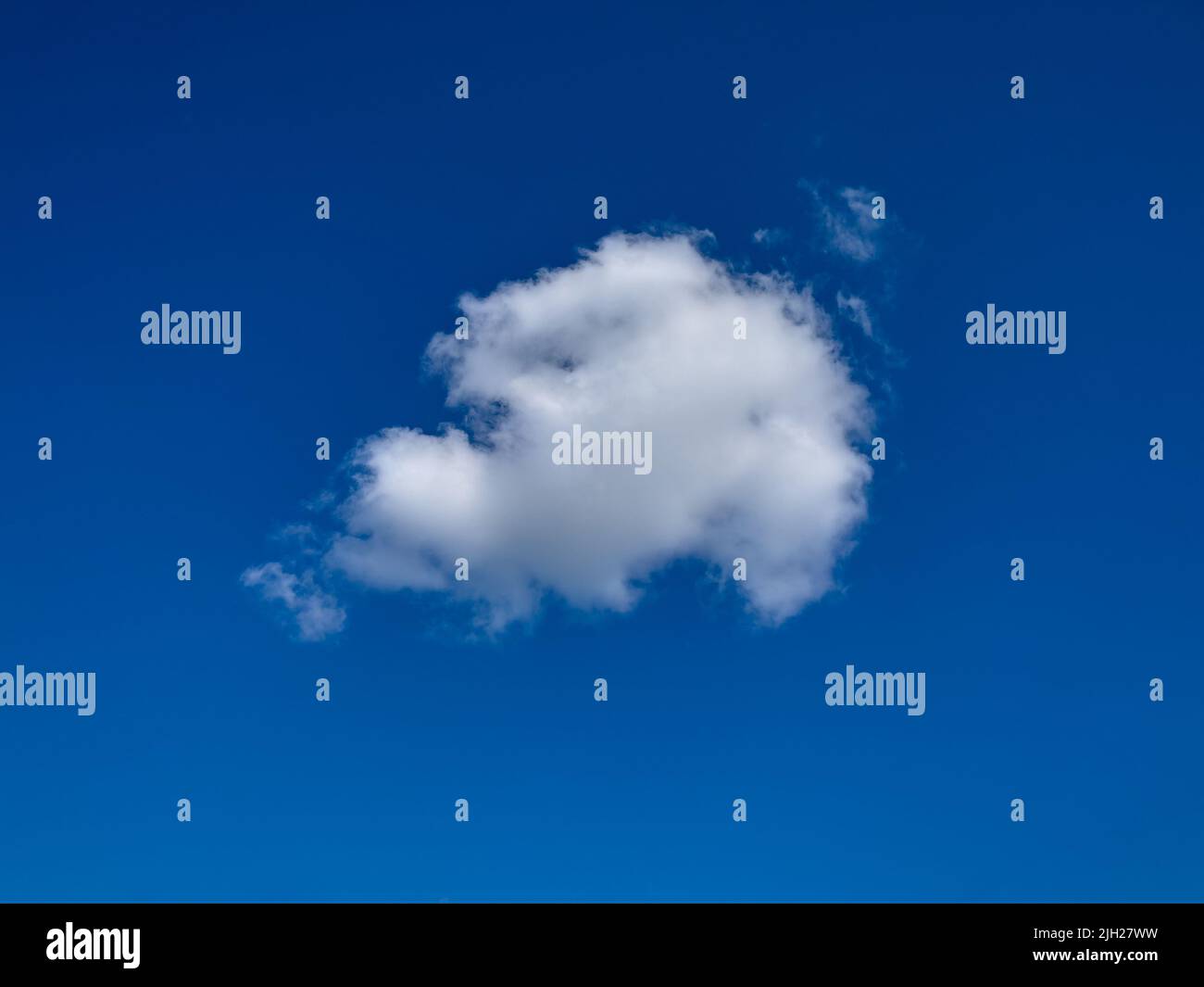 One fluffy cloud in the blue sky. Stock Photo