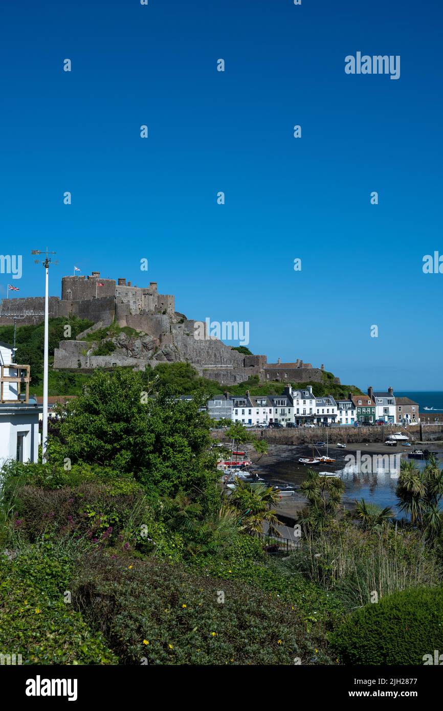 The iconic EMont Orgueil Castle guarding the entrance to Gorey harbour of the British Crown Dependency of Jersey, Channel Islands, British Isles. Stock Photo