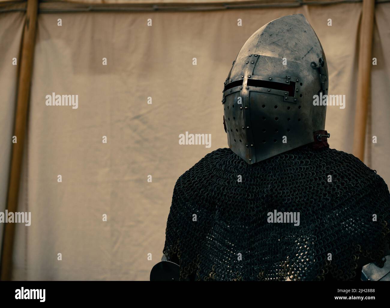 dramatic medieval plate armor scene with helmet Stock Photo