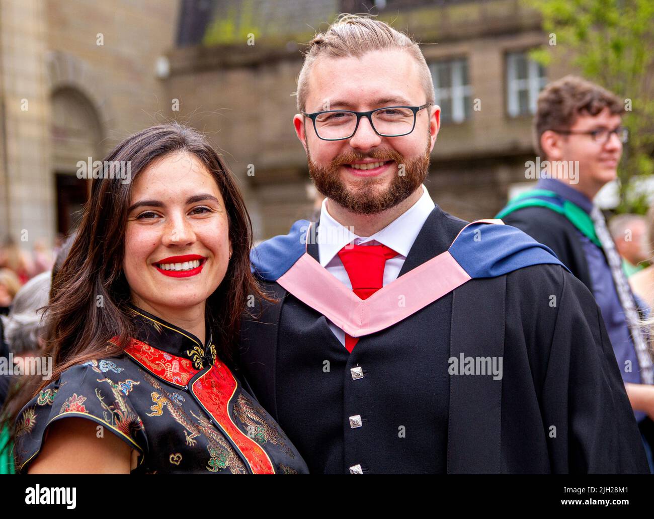 Dundee, Tayside, Scotland, UK. 14th July, 2022. Temperatures in North East Scotland surpassed 20°C due to a mix of patchy cloud, scattered showers, and sunny spells. Today is the second of three Dundee Abertay University Summer Graduation Ceremony 2022 days. Graduating Abertay University students and their families gather in Dundee City Square and the Caird Hall on Graduation Day for their belated awards. These graduation ceremonies are now taking place because Scotland has been under Coronavirus lockdown for the past two years. Credit: Dundee Photographics/Alamy Live News Stock Photo