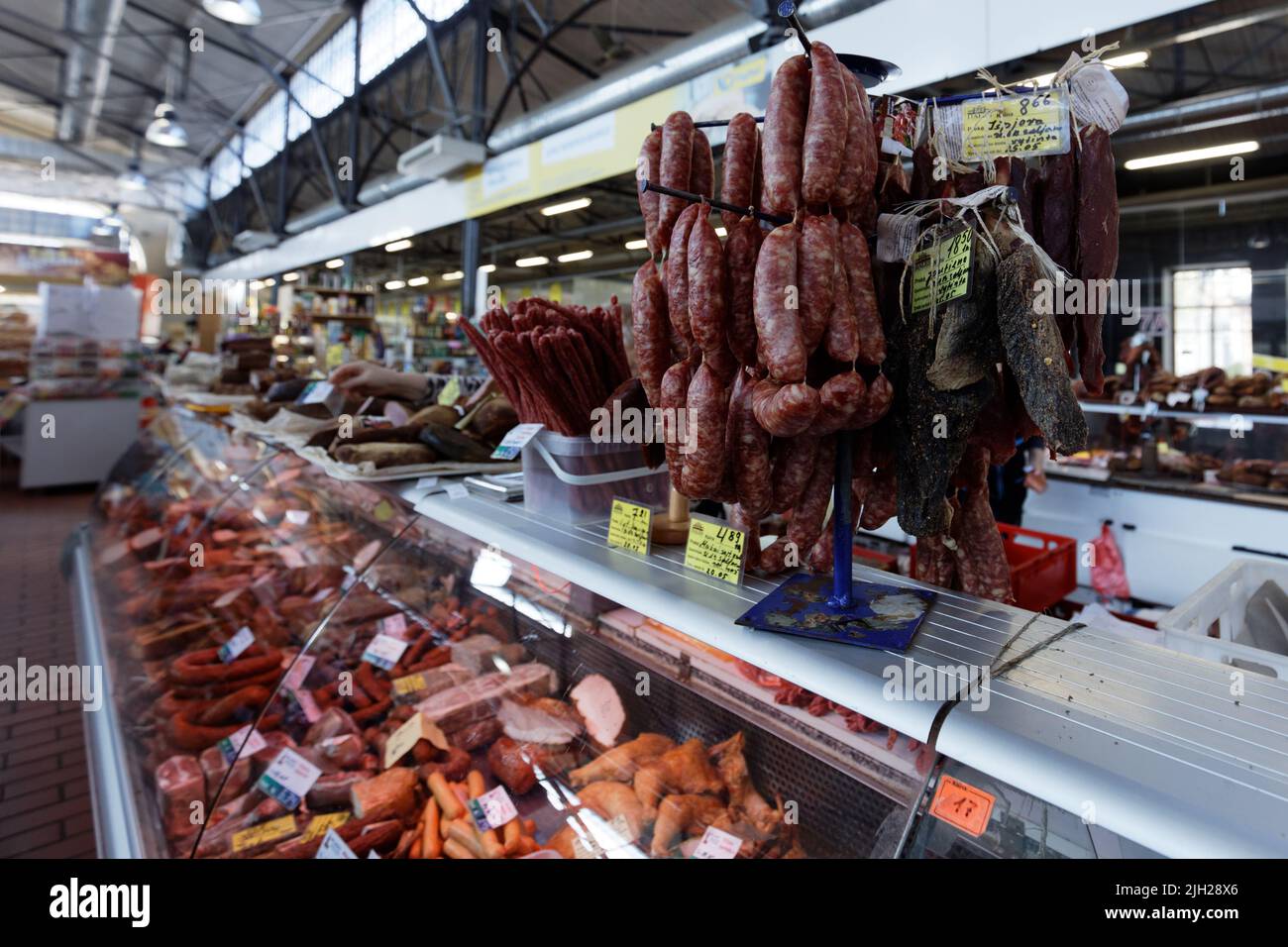Meat stalls at Hales market, the largest and oldest farmer's market of Vilnius, Lithuania Stock Photo