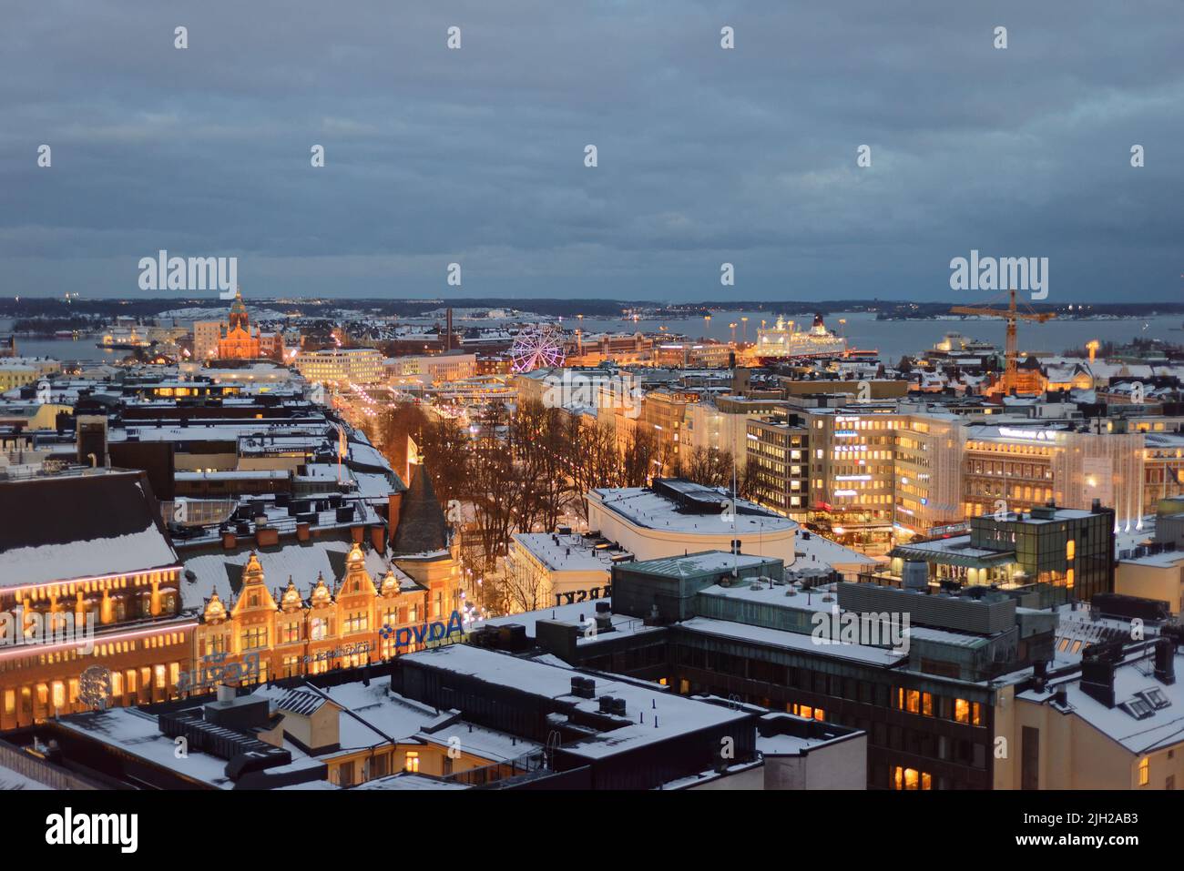 Night winter cityscape of Helsinki, Finland: view from Torni hotel in direction of South Harbour Stock Photo