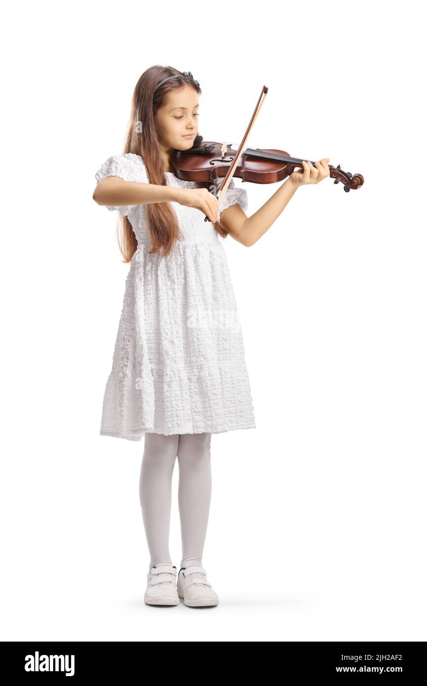 Full length portrait of a girl in a white dress playing a violin ...