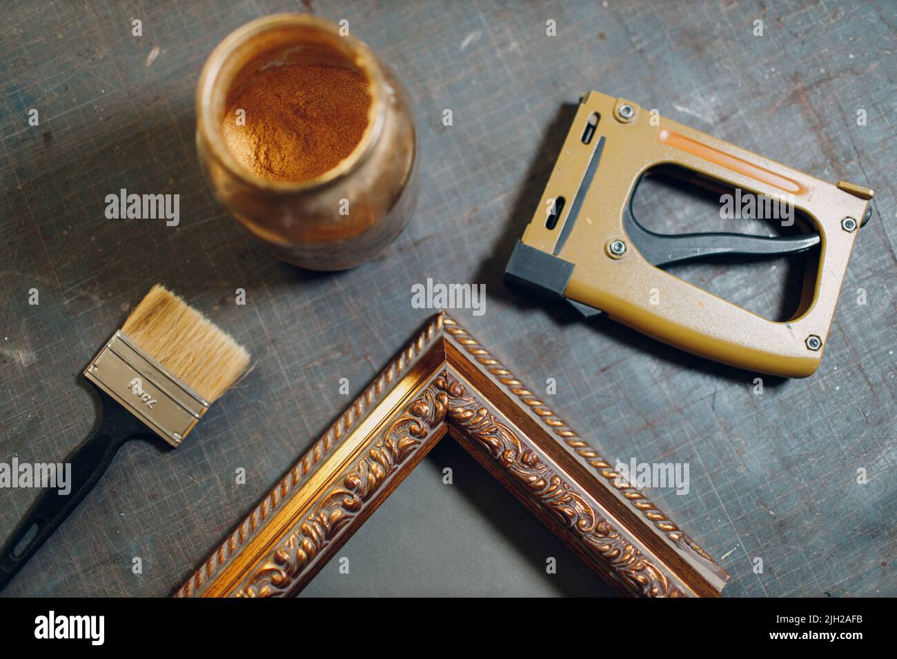 Restoration, recovery, renewal picture frame for museum painting art picture. Painting baguette handmade picture frame at studio. Stock Photo