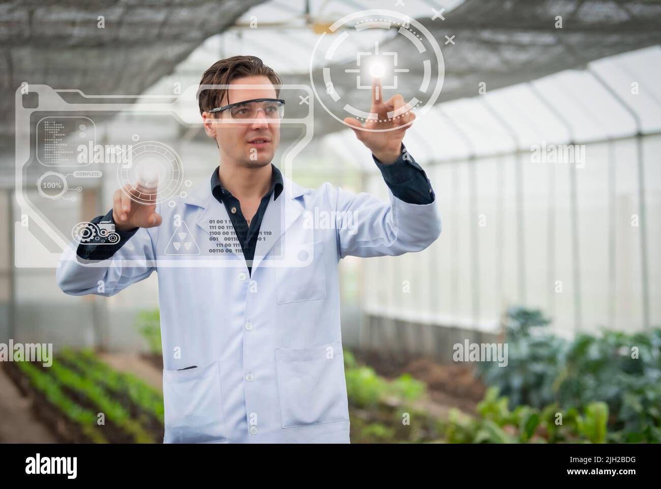 Portrait of handsome agricultural researcher working on research at