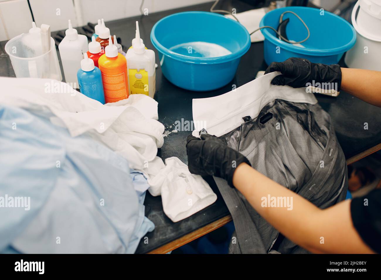 Dry cleaning clothes. Clean cloth chemical process. Laundry industrial