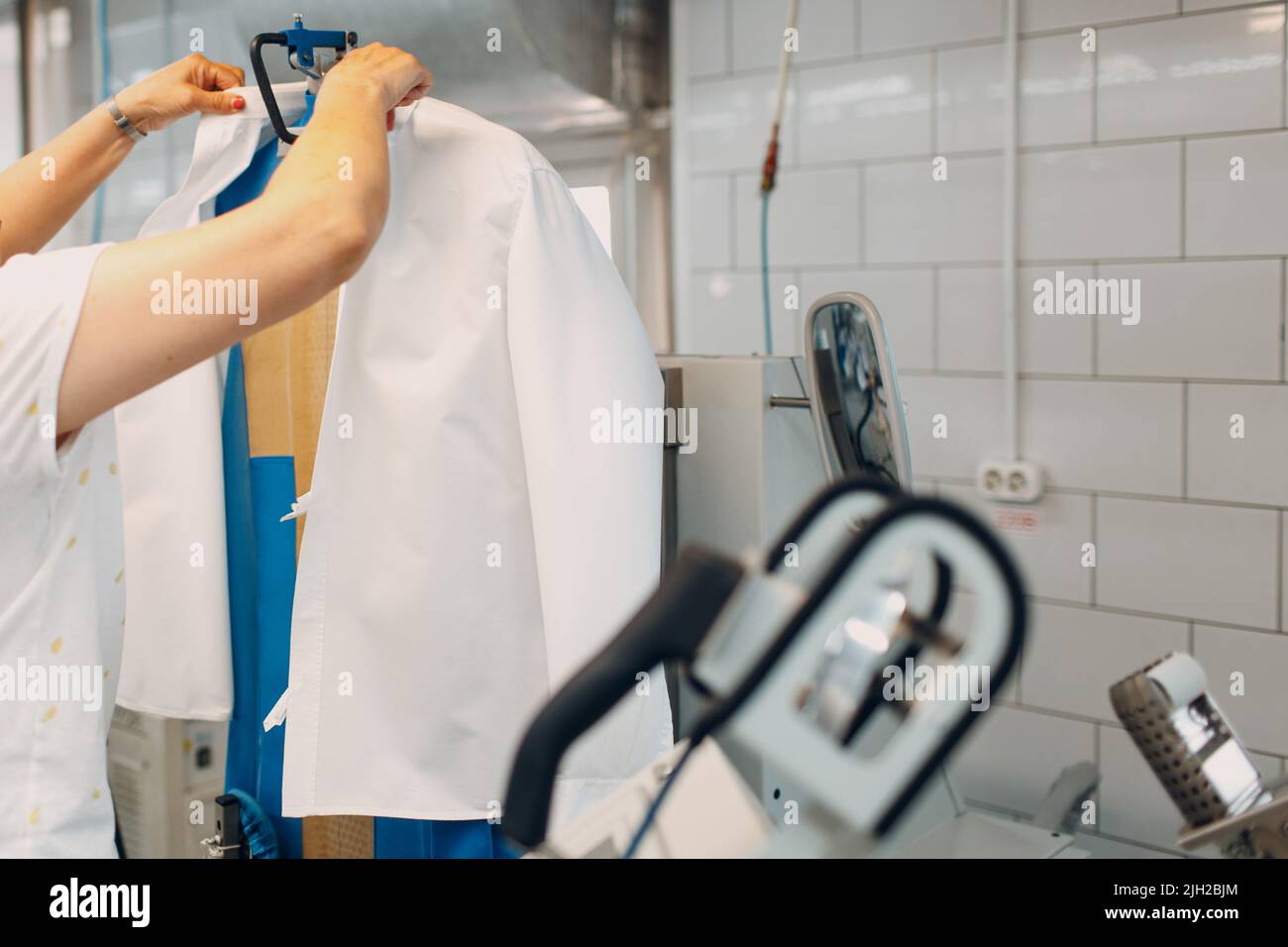 Dry cleaning clothes. Clean cloth chemical process. Laundry industrial