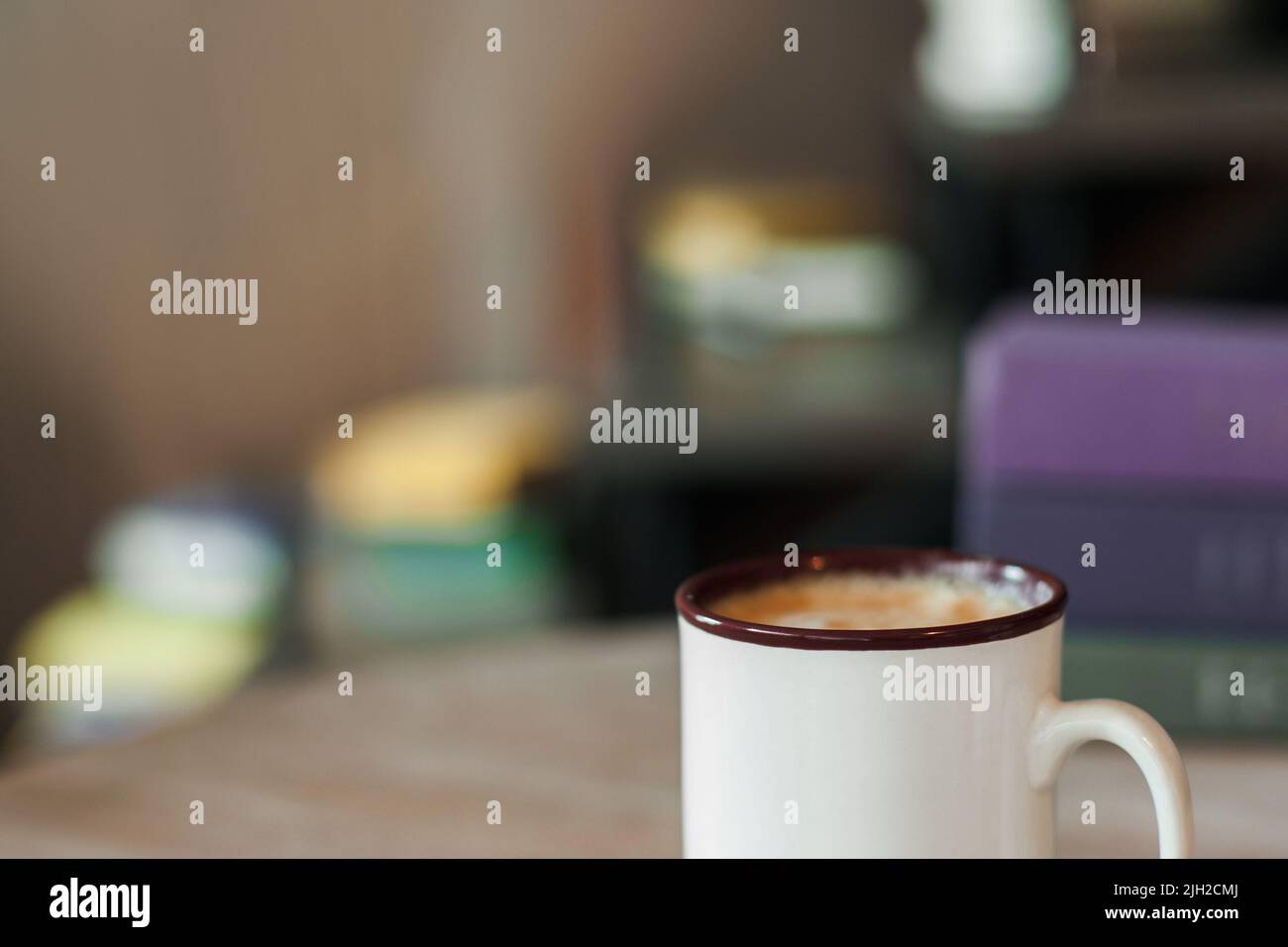 Cup of cappuccino on blurred office background Stock Photo