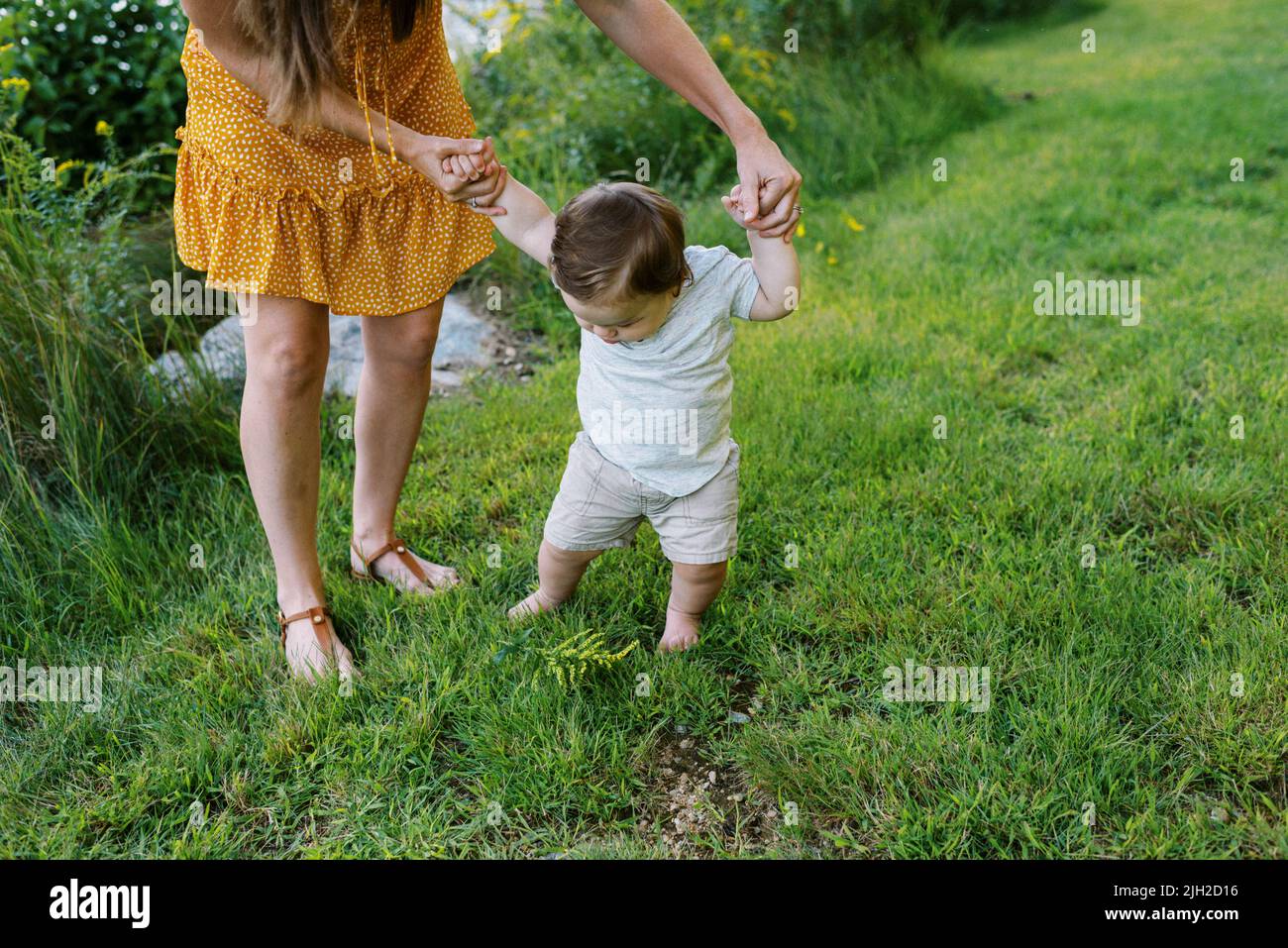 Baby boy learning to walk hi-res stock photography and images - Alamy