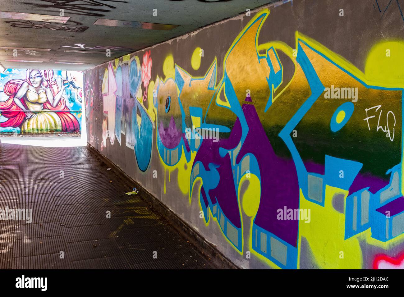 Colourful street art graffiti in a Cardiff underpass, subway. Stock Photo