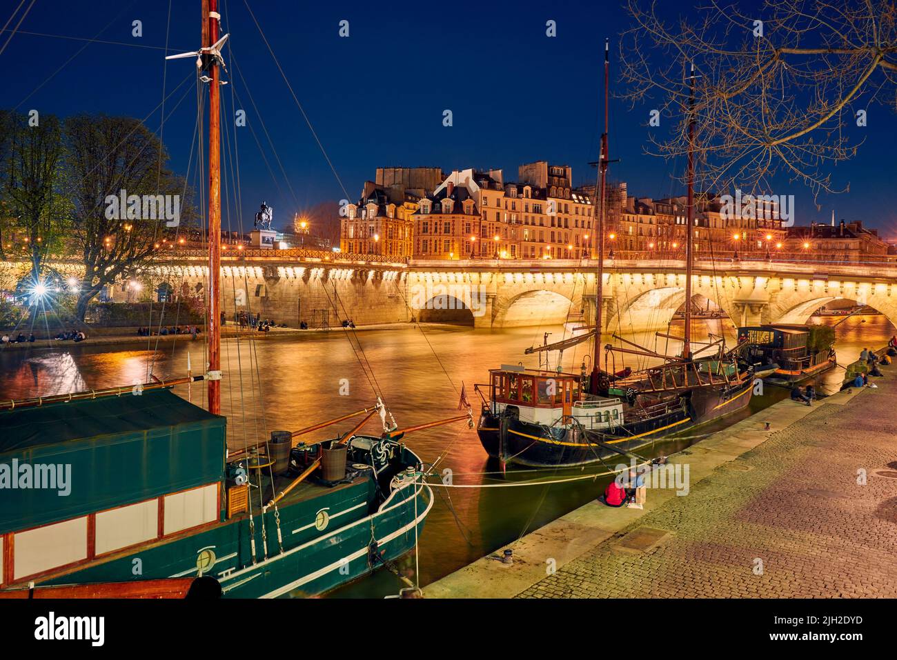 Barges on the Seine in Paris at night Stock Photo