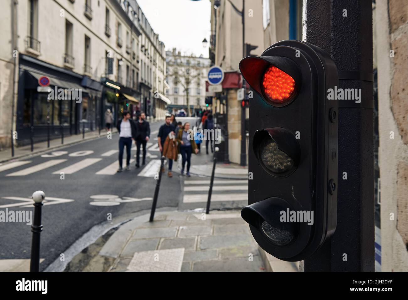 Traffic light with red color in Paris Stock Photo