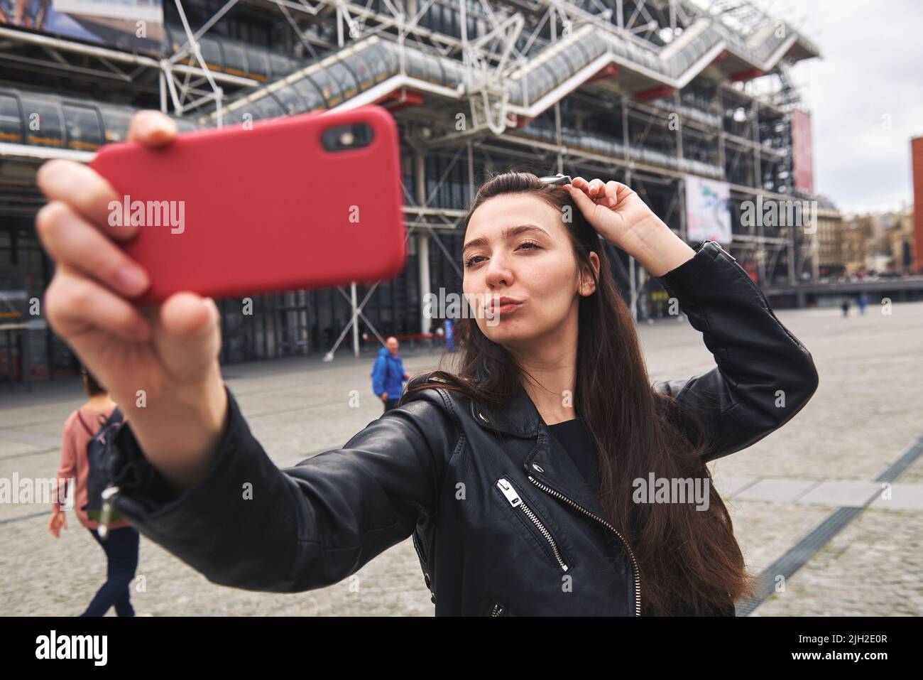 The girl makes selfie in front of the Pompidou center in paris Stock Photo
