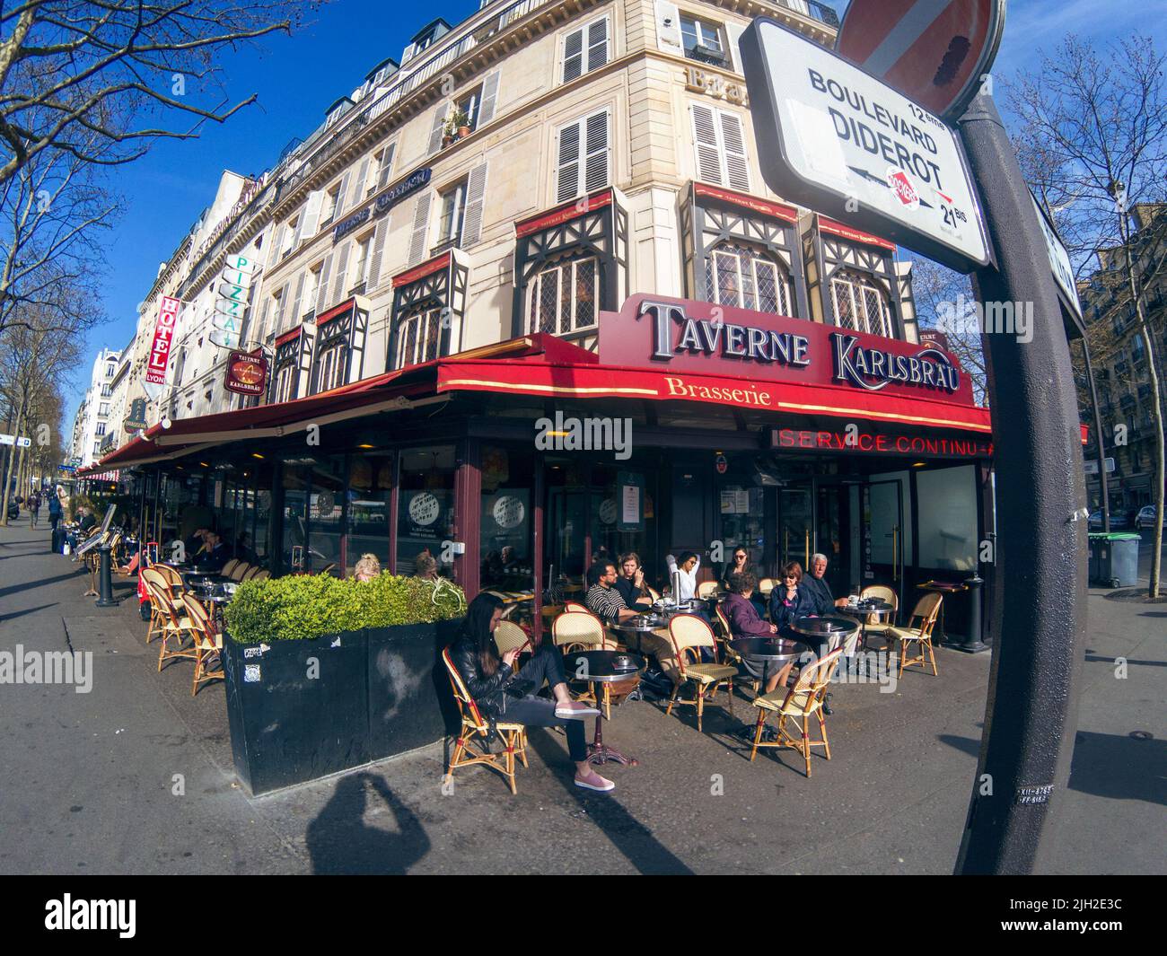 PARIS, FRANCE -APRIL 8, 2018: People having breakfast in a cafe Stock Photo