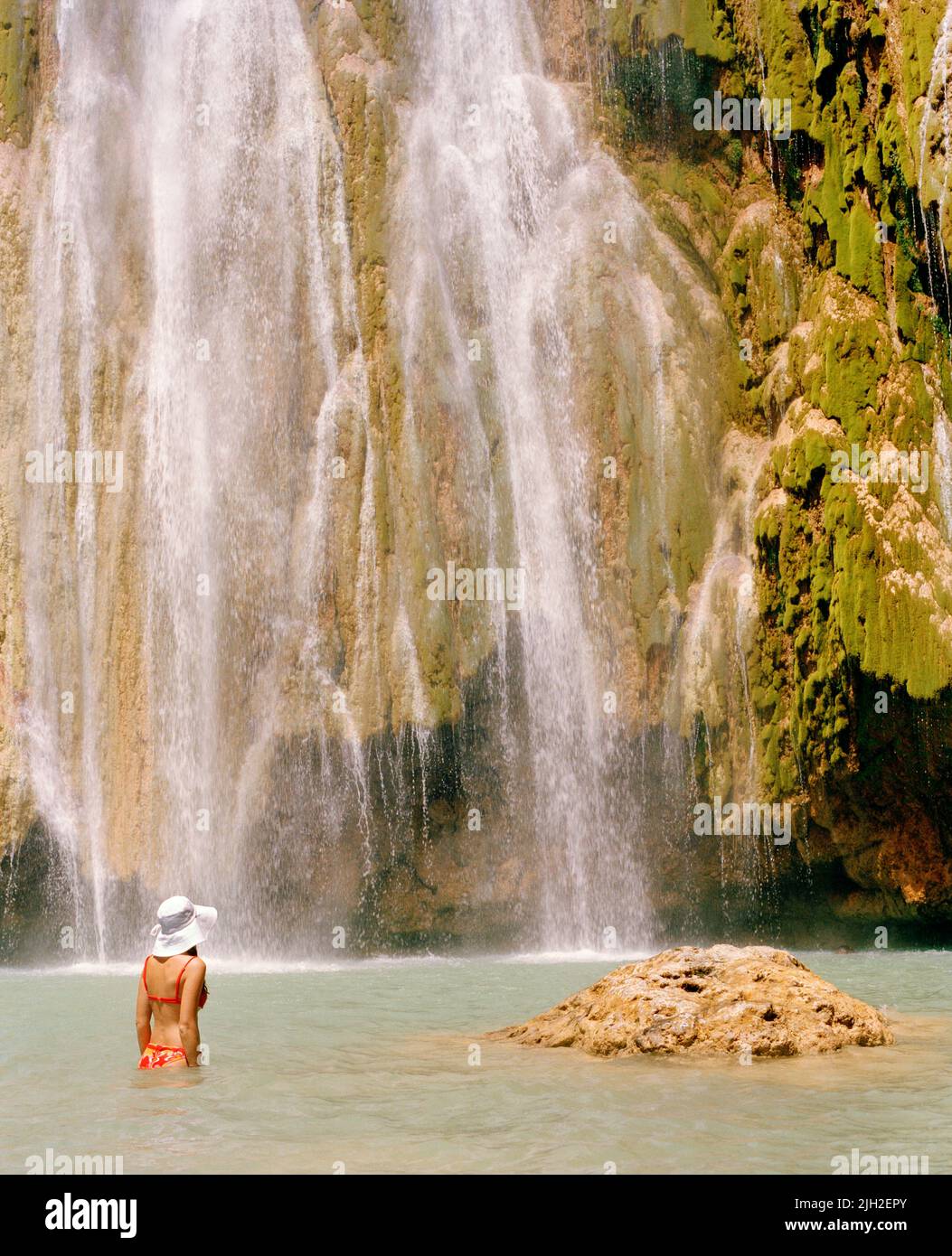 Woman swimming at El Limon waterfall , Samana Peninsula, Dominican Republic Stock Photo