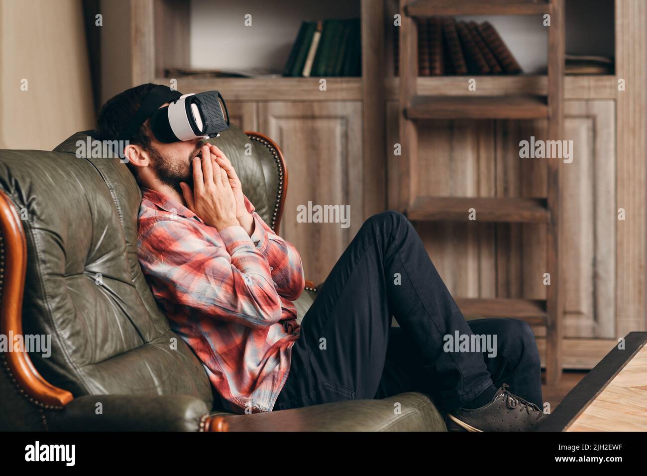Excited man watching video in vr glasses Stock Photo