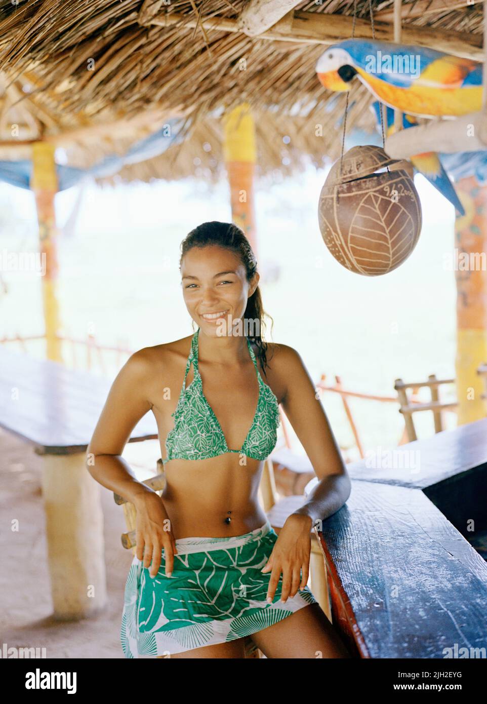 Smiling woman at beach bar. Playa Rincon, Las Galeras, Samana Peninsula, Dominican Republic. Stock Photo