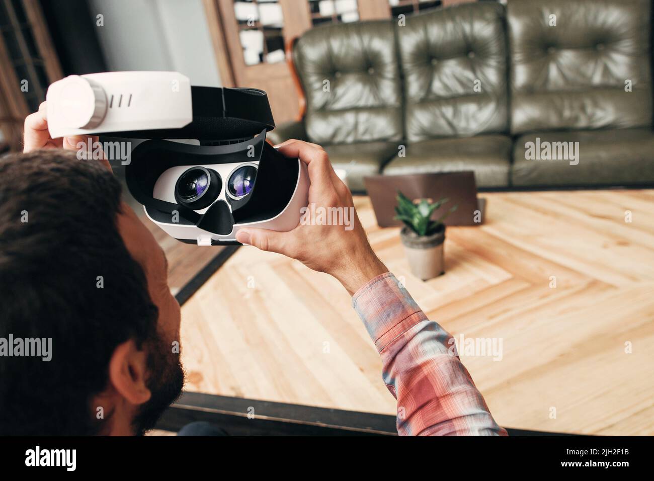 Back view of man wearing virtual reality glasses Stock Photo - Alamy