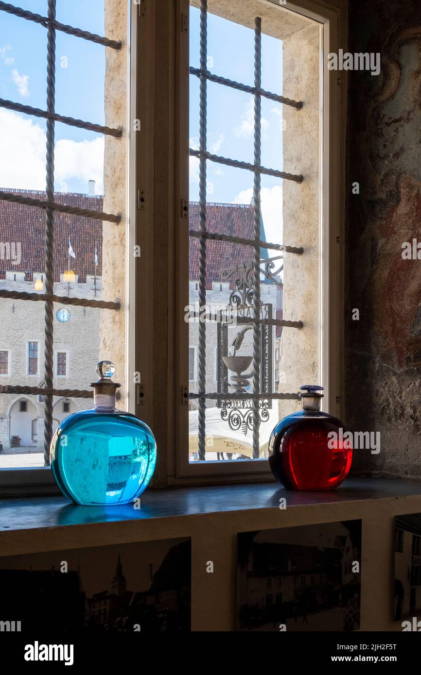 Glass bottles on the window, in an old pharmacy in Tallinn Stock Photo