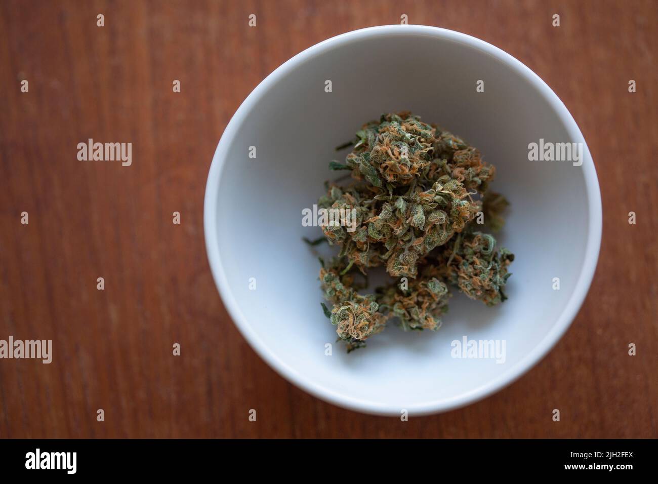 Top view of a bowl with cannabis sativa Stock Photo