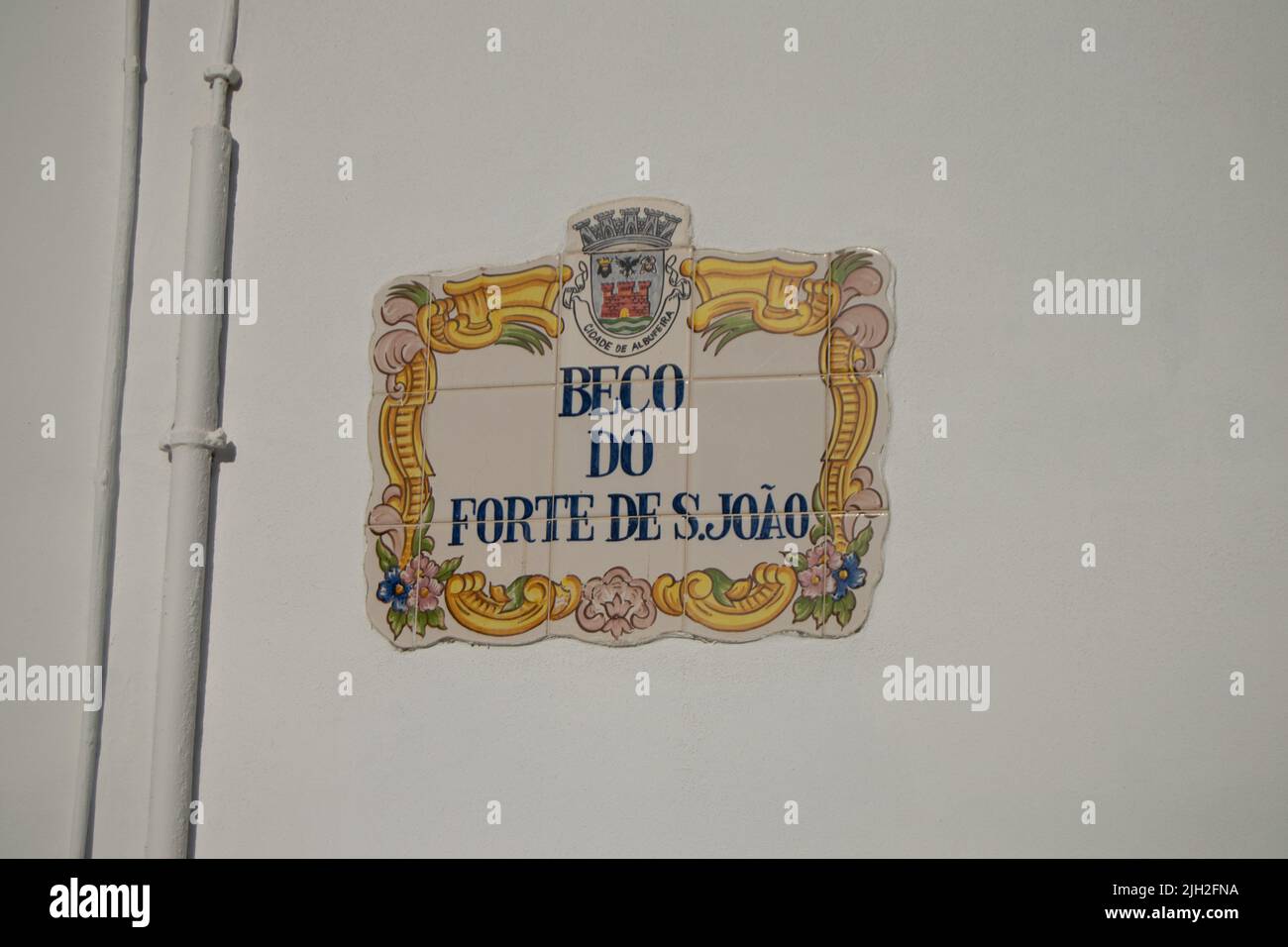 Beco do forte de São Julião, portuguese tradicional street name on ceramic painted tiles. Stock Photo