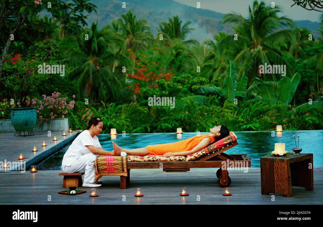 A candle light pool side massage. San Benito, Philippines. Stock Photo