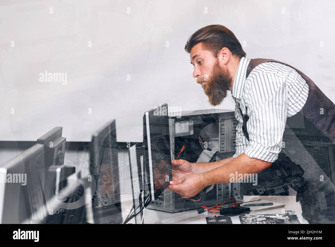 Computer monitor tuning in office, double exposure Stock Photo