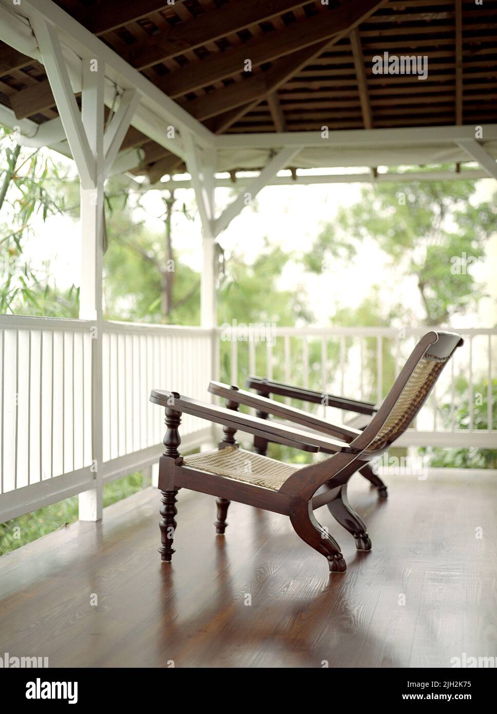 Deck chairs invite guests to relax at a resort in Jamaica. Stock Photo