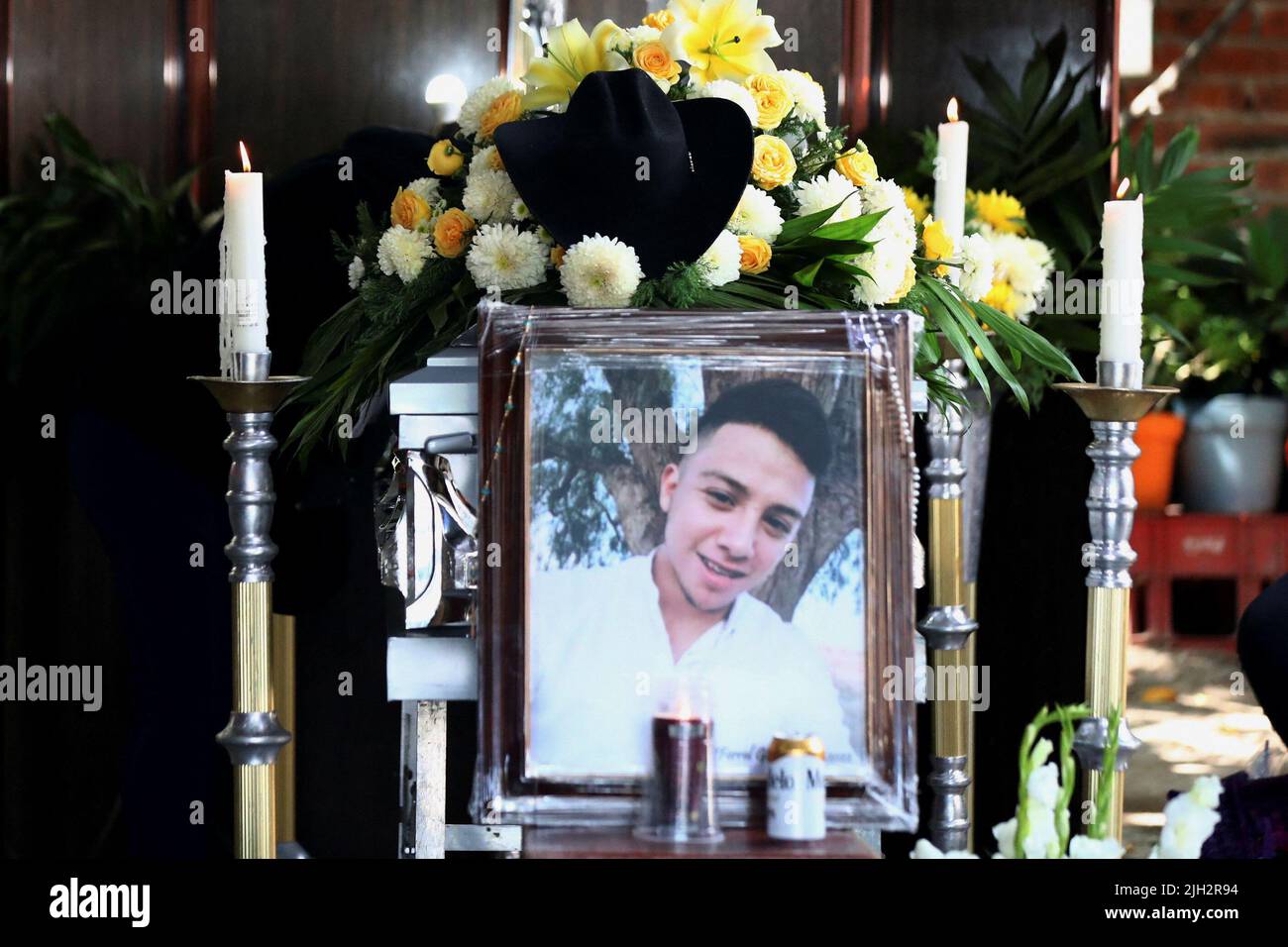 A view shows a framed photo of late migrant Efrain Ferrel, 22, during his wake after being repatriated from San Antonio, Texas, U.S., at his family's home in Celaya, in Guanajuato state, Mexico July 14, 2022. REUTERS/Edgard Garrido Stock Photo