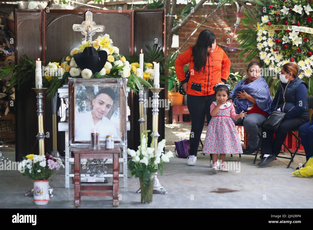 Relatives of late migrant Efrain Ferrel, 22, attend his wake, after being repatriated from San Antonio, Texas, U.S., at his family's home in Celaya, in Guanajuato state, Mexico July 14, 2022. REUTERS/Edgard Garrido Stock Photo