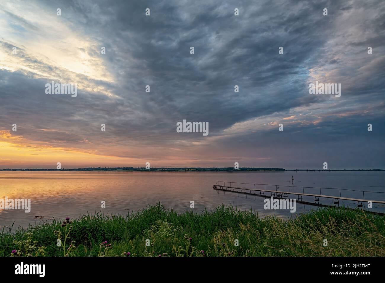 A view of faro island at sunset as veiwed from stubbekoping in Denmark. Stock Photo