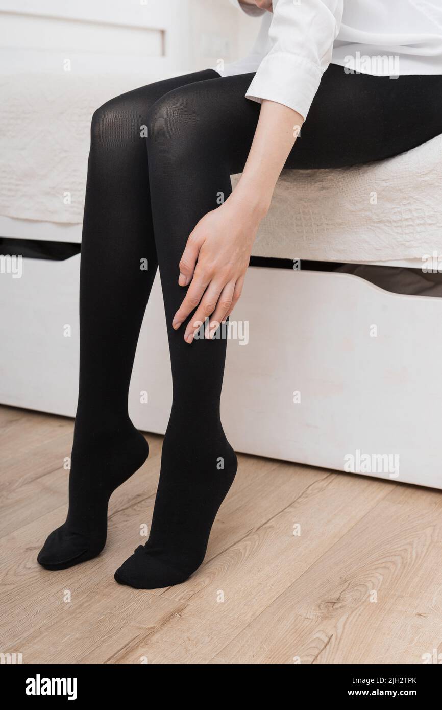 Beautiful Female Legs In Classic Black Shoes And Skin Color Tights Isolated  On White Stock Photo - Download Image Now - iStock