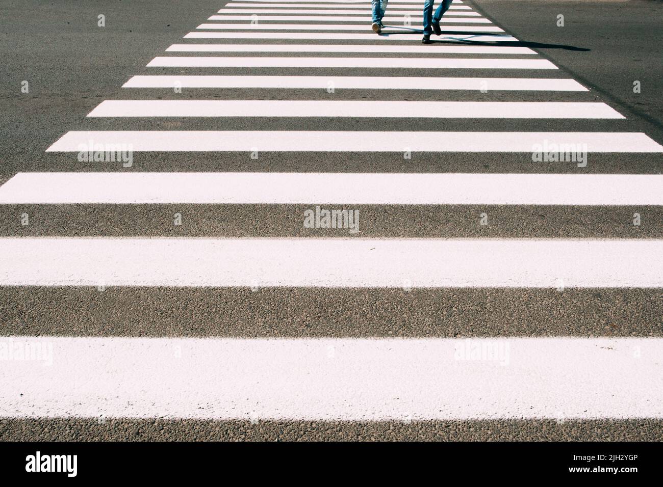 Crossroad with walking people background Stock Photo - Alamy