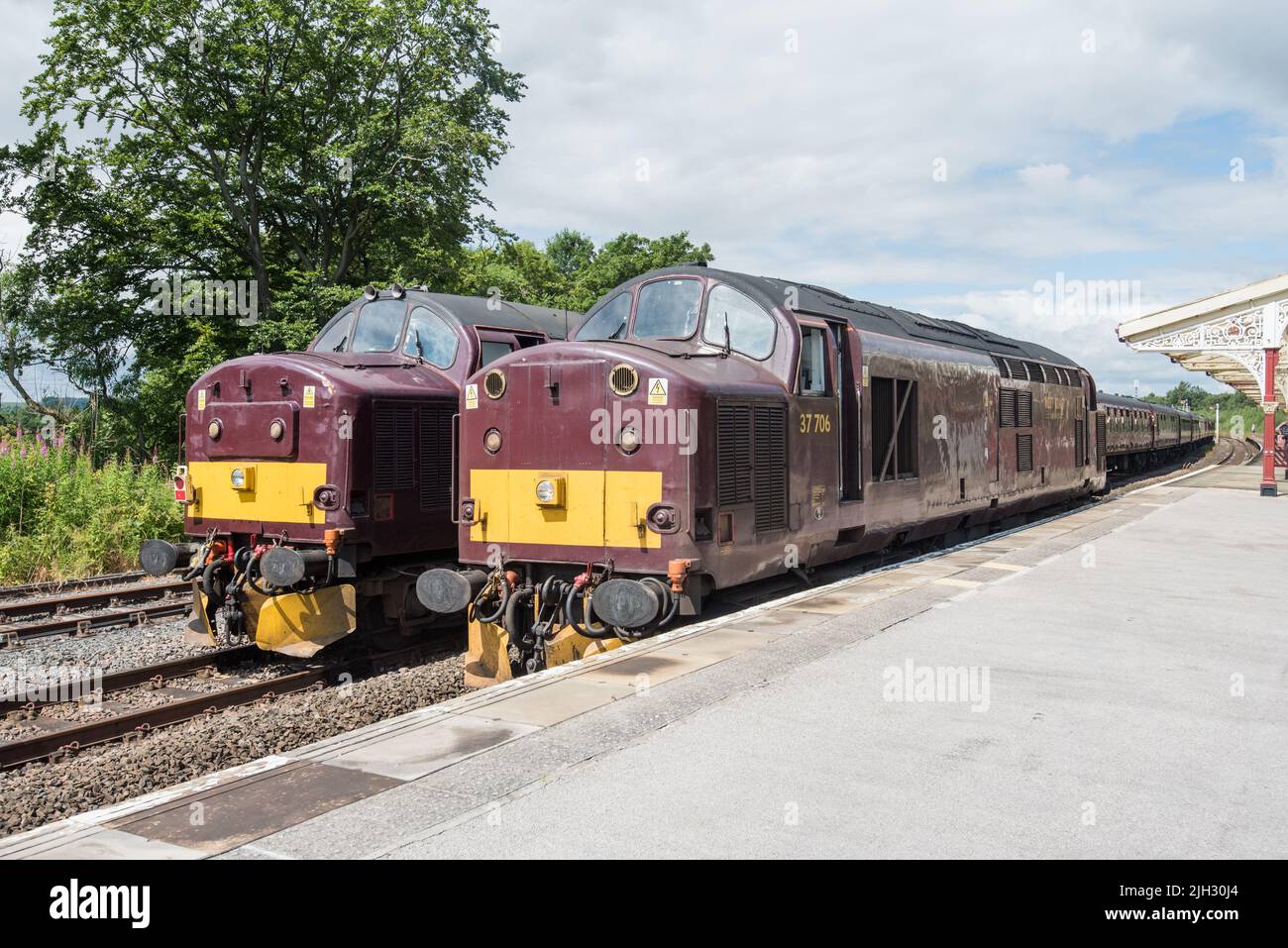 Class 37 diesel electric 37706 and 37676 on adjacent lines at Hellifield station 14th Jjuly 2022 Stock Photo