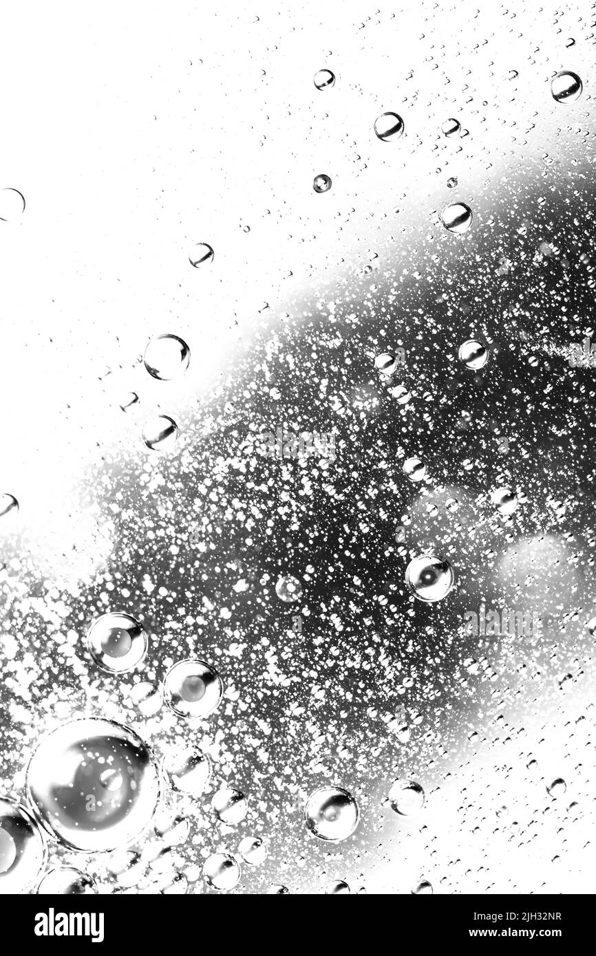 Abstract backdrop with oil drops and waves on water surface Stock Photo Alamy