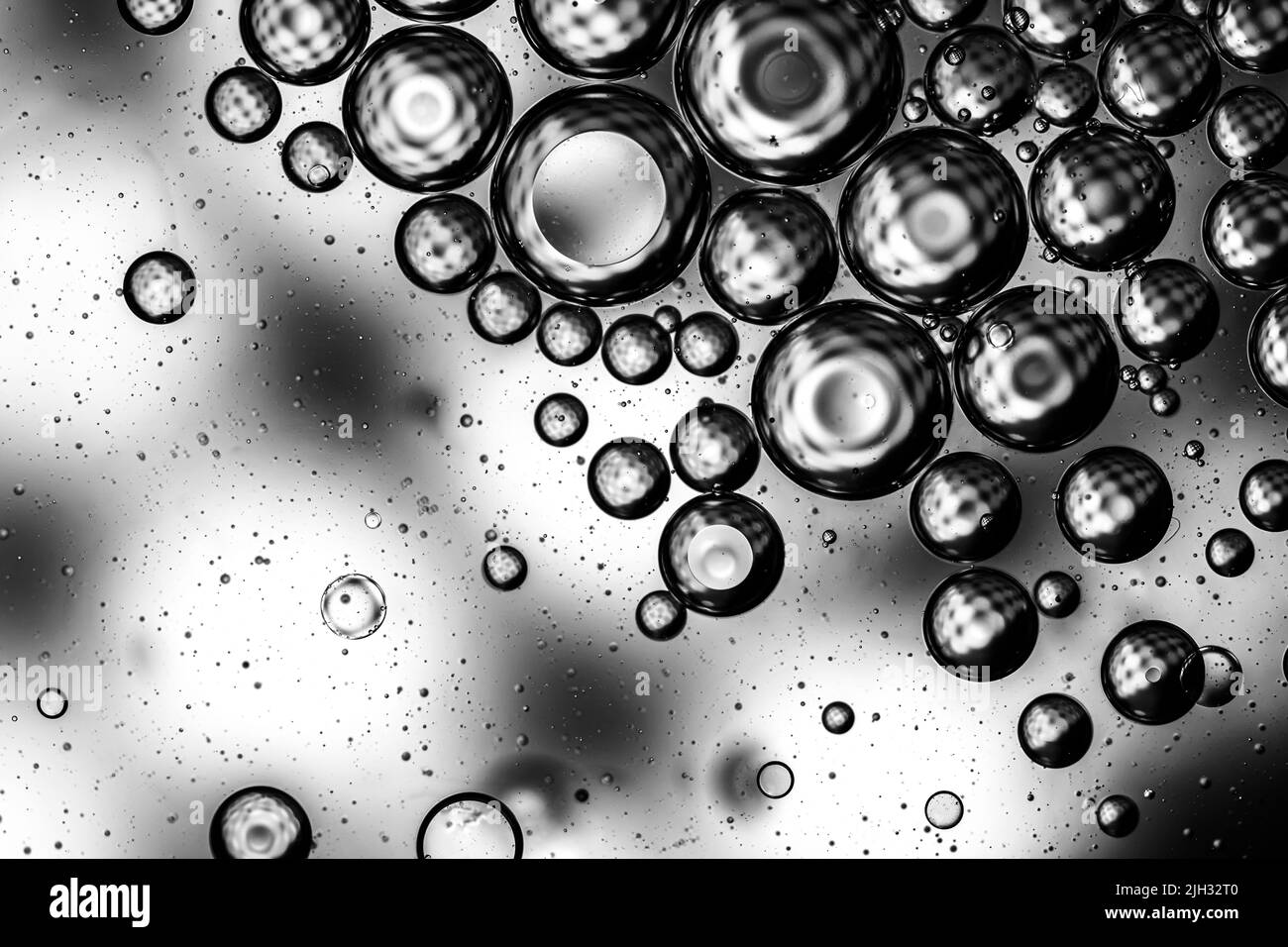 Abstract backdrop with oil drops and waves on water surface Stock Photo Alamy
