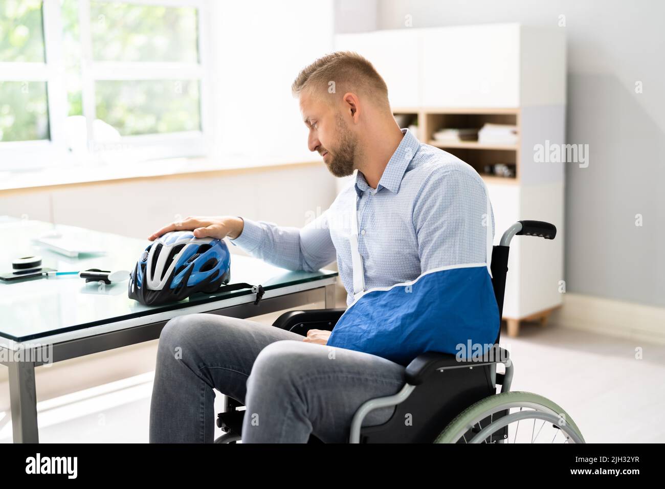 Motorcycle Accident Injury. Man With Arm Fracture. Hand Recovery Stock Photo
