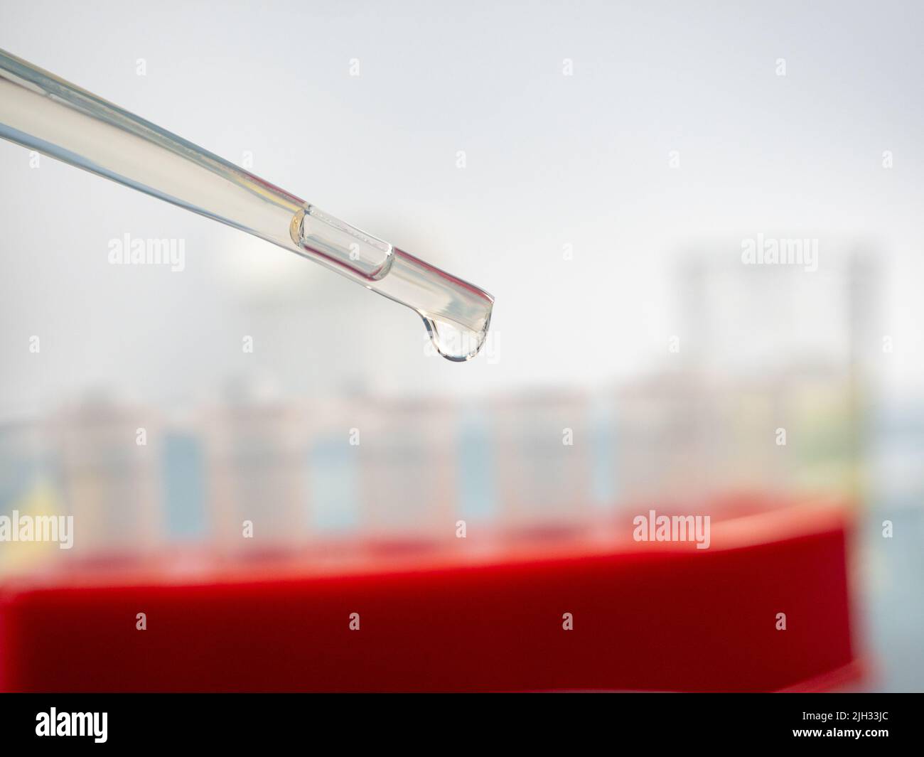 Analytical chemistry sample being pipetted into test tube for