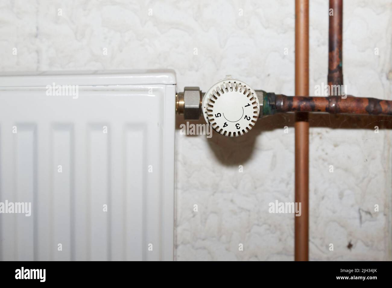 radiators with thermostat and old copper pipes, a heating system Stock