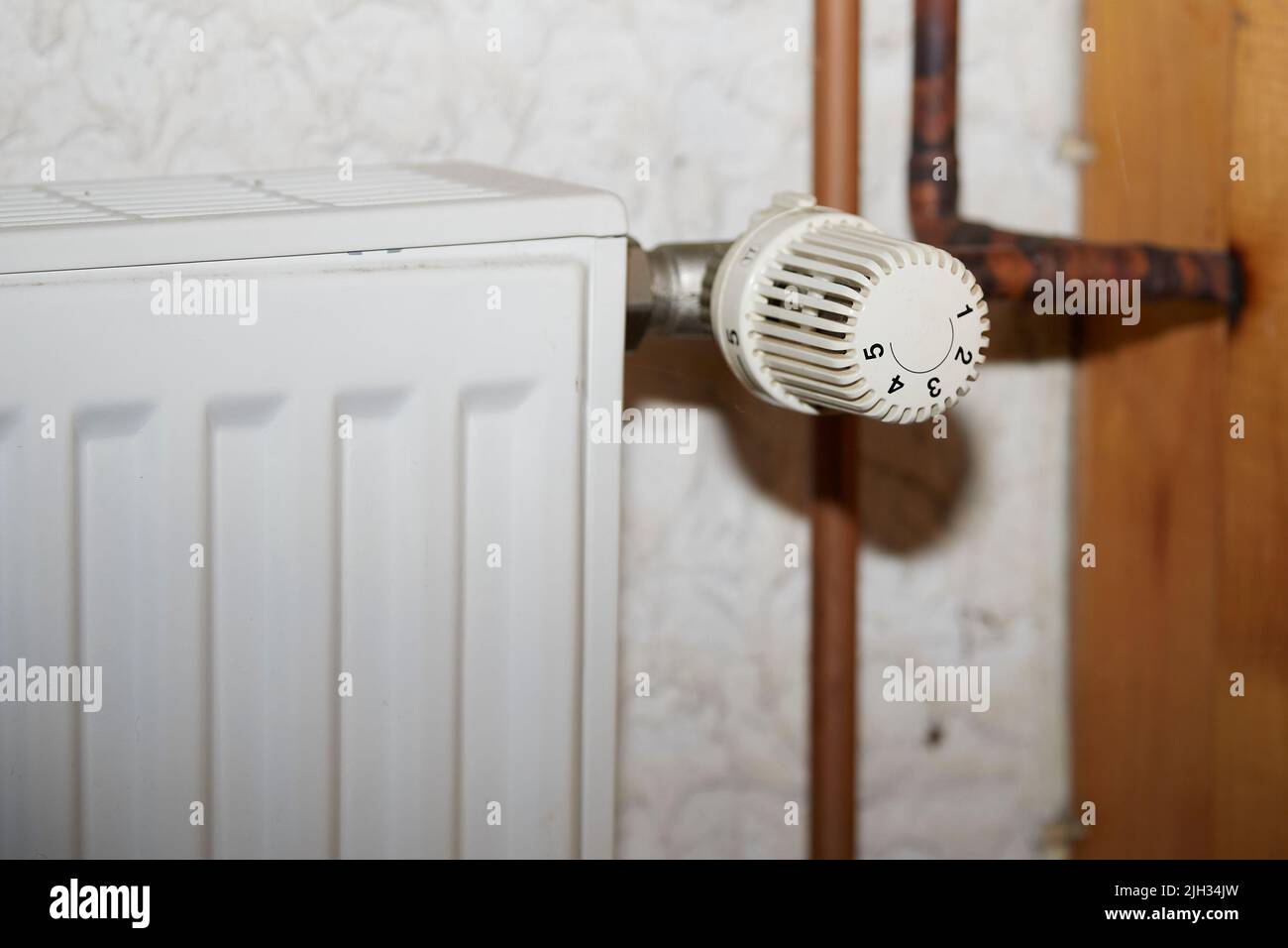 radiators with thermostat and old copper pipes, a heating system Stock